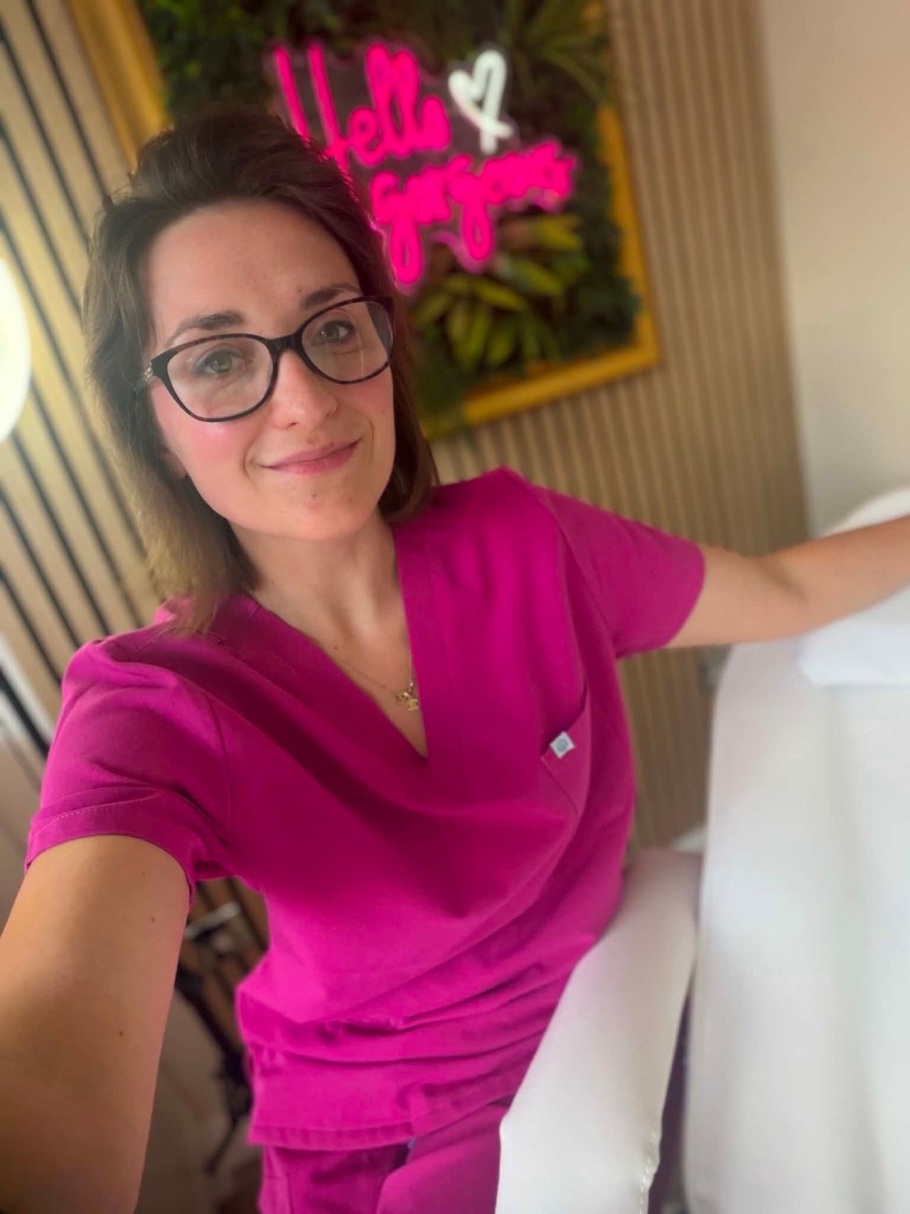 A highly professional, elegant portrait of an aesthetic practitioner named Justyna.